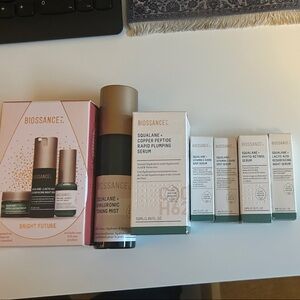 Biossance Green and White Skincare Set with Gold Accents